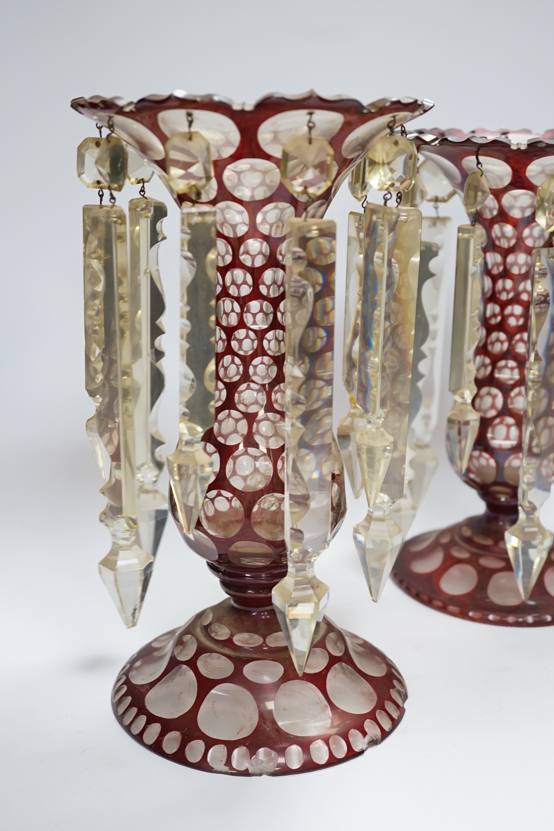 A pair of late 19th century Bohemian ruby flashed glass lustres, 30cm tall